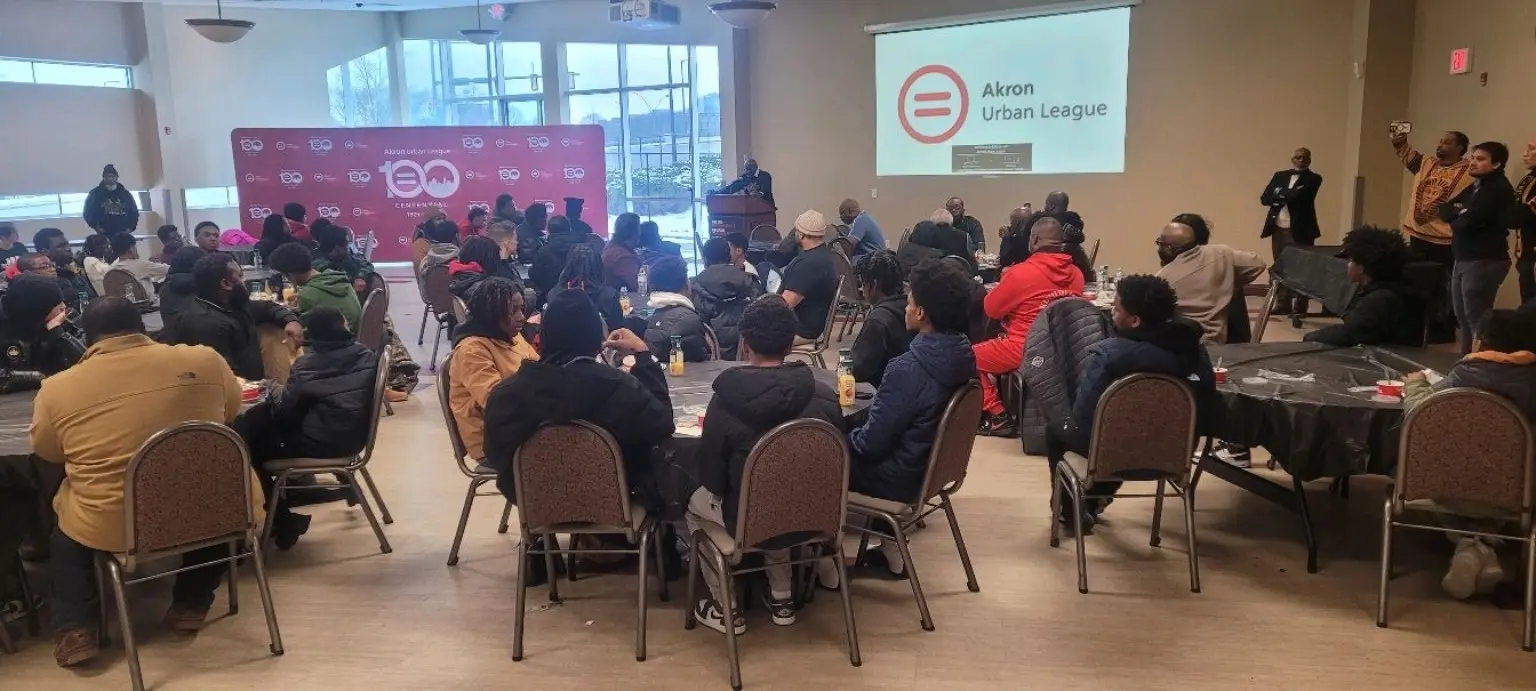 Young people and mentors attending an Akron community wellness and resource event