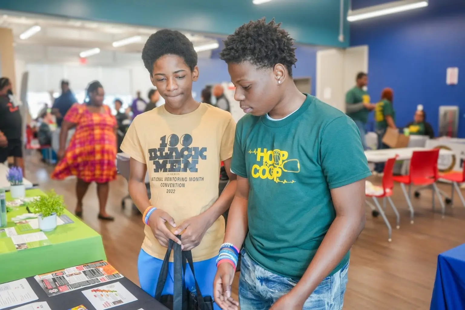 Young people exploring career and community resources at an Akron event